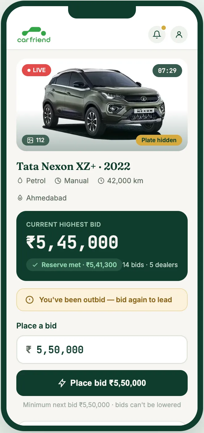 Live auction screen showing current highest bid and place bid button